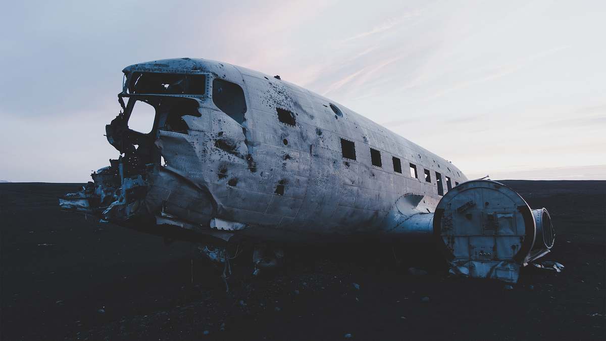 plane wreck abandoned airplane on the floor under white clouds iceland